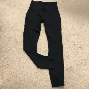 Lululemon size 4 black leggings with mesh side detail.